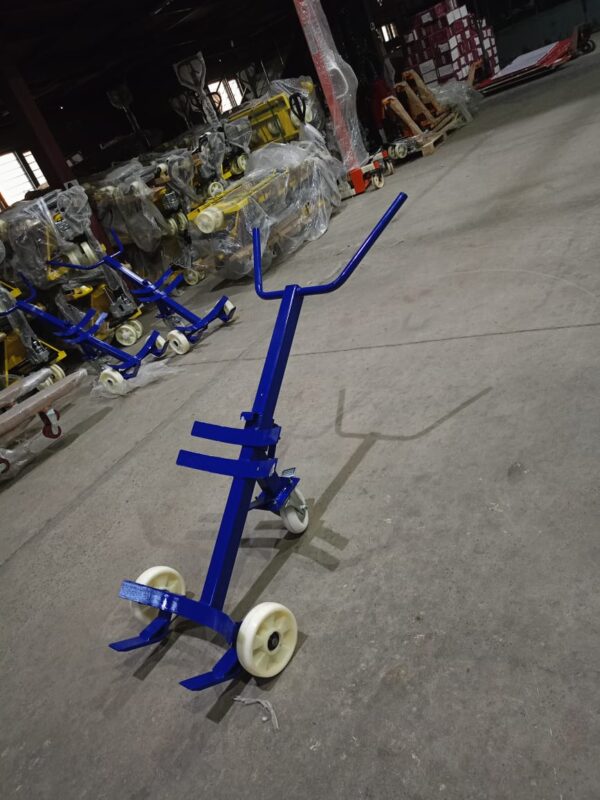 Steel drum trolley with puncture‑proof wheels in warehouse aisle